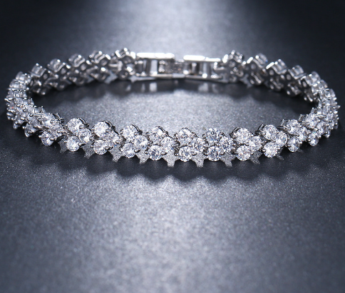 Elegant silver Zircon Bracelet featuring a sparkling design, displayed on a dark surface by PureAura.
