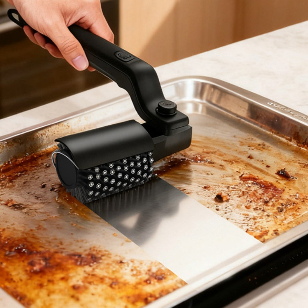 A hand using the Electric BBQ Grill Brush Cleaner on a dirty grill pan, showcasing its sleek black design by PureAura.