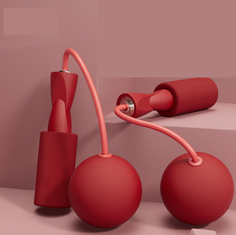 Red cordless dual-use skipping rope showcasing smooth balls and comfortable grips, by PureAura.