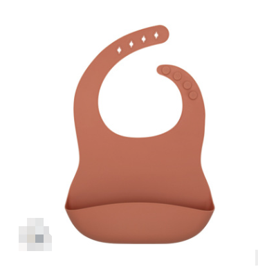 Rust-colored silicone Waterproof Baby Bib by PureAura features a scoop pocket for mess-free feeding.