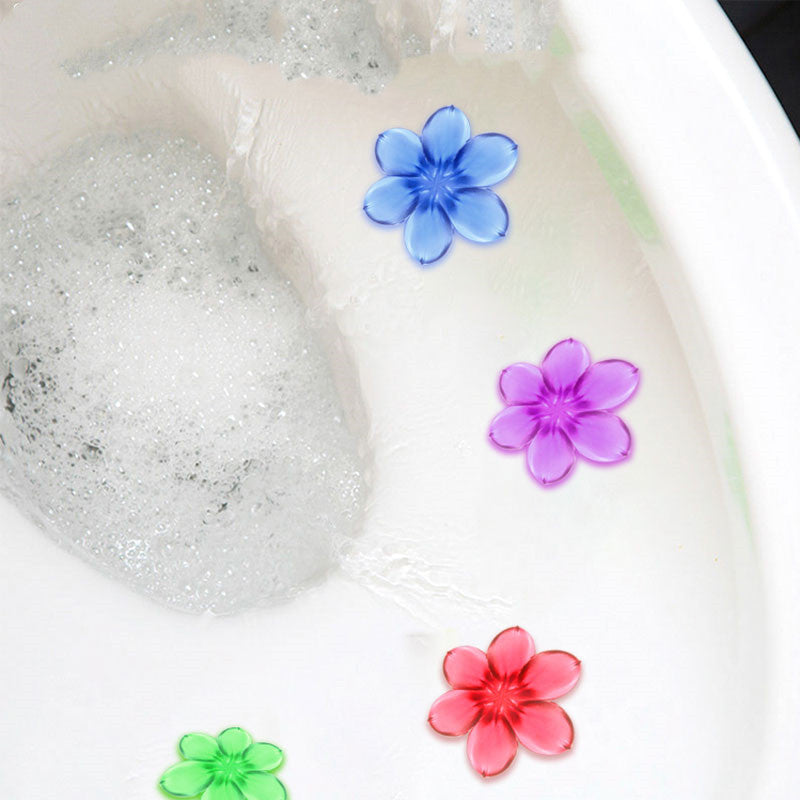 Colorful floral-shaped floating gel pieces softly resting in a bubbly bath, enhancing the ambiance with floral scent by PureA