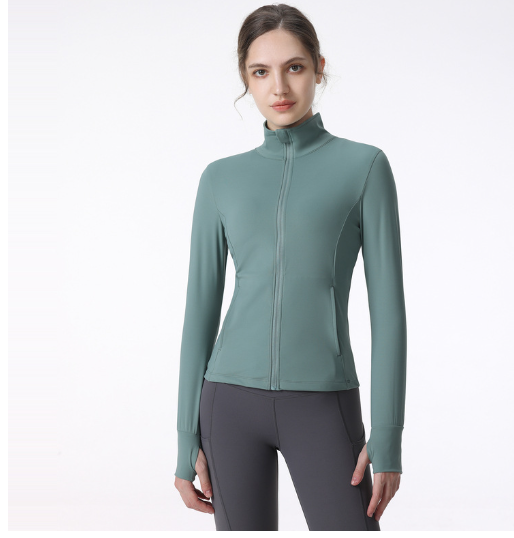 A model wears a fitted light green Women's Long Sleeve Zip Sports Jacket for Yoga & Running by PureAura.