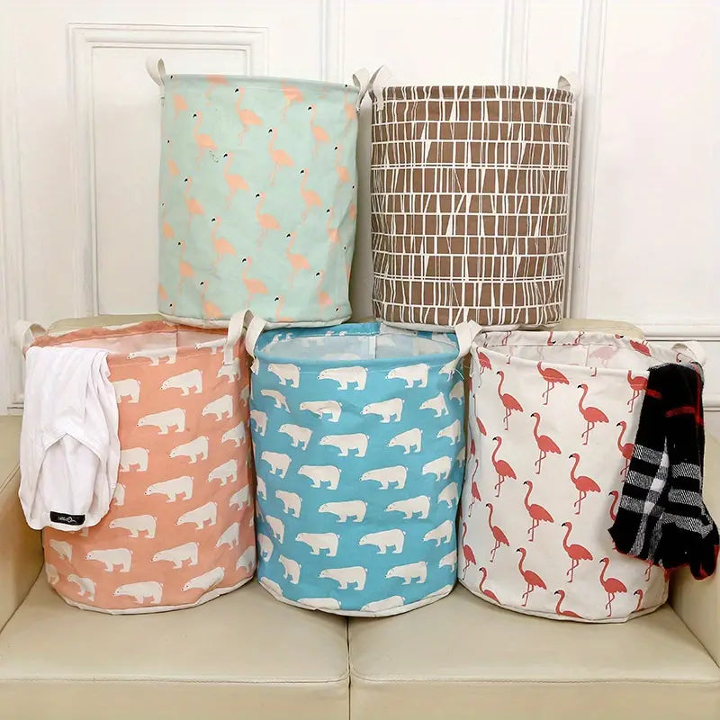 Colorful cotton linen laundry baskets, featuring polar bears and flamingos, arranged on a couch by PureAura.