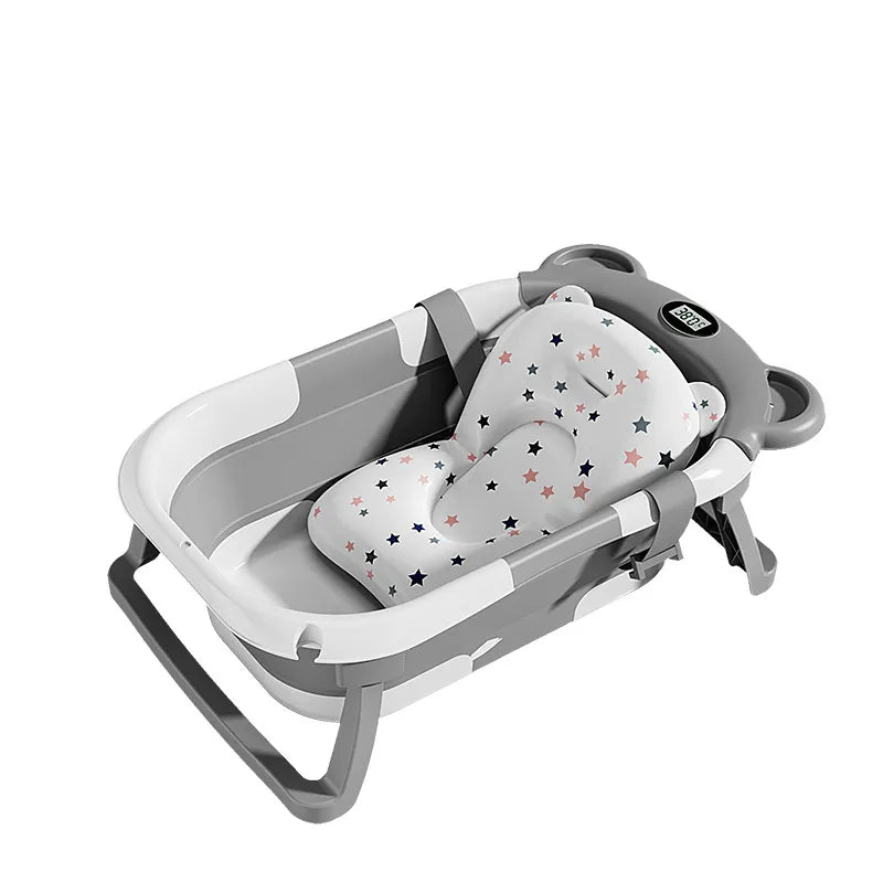The Newborn Temp-Sensing Baby Tub features a gray design with a star-patterned insert for added comfort by PureAura.