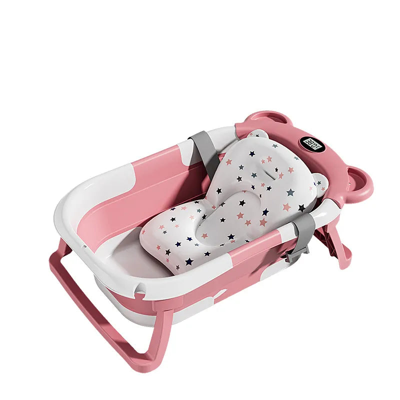 Pink Newborn Temp-Sensing Baby Tub features a star-patterned seat and secure straps for safety by PureAura.