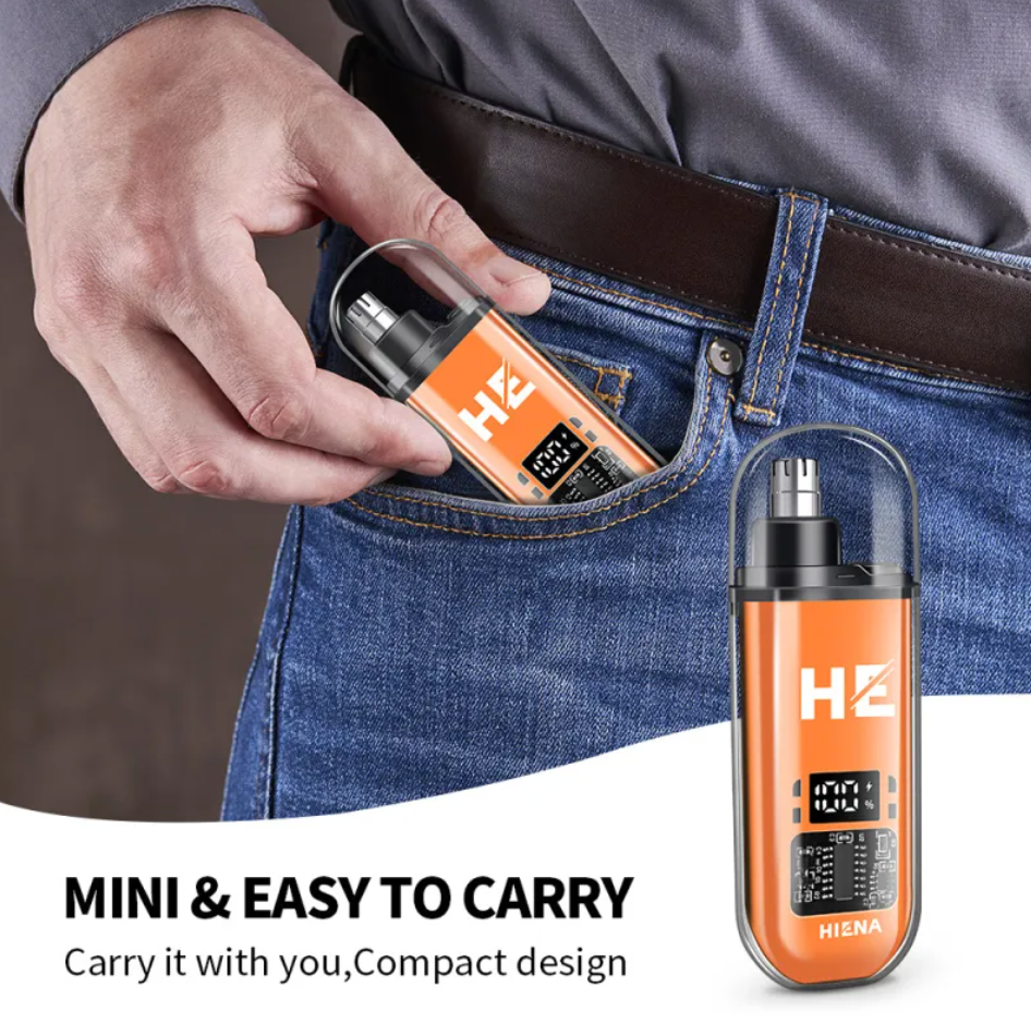 A person placing the compact orange Portable Electric Nose Hair Trimmer by PureAura in their pocket for easy carrying.