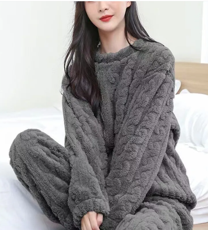 Cozy winter outfit showcasing a woman in a warm gray Winter Coral Velvet Pajama Set by PureAura.