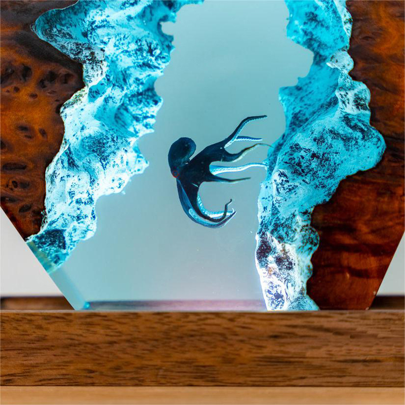 Vibrant 3D diver octopus night lamp showcases intricate epoxy details against a rich wooden base by PureAura.