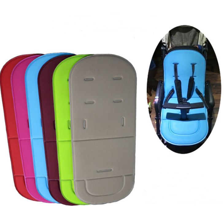 Vibrant Universal Cotton Baby Stroller Cushion and Seat Pad options stacked beside a blue cushion in use by PureAura.