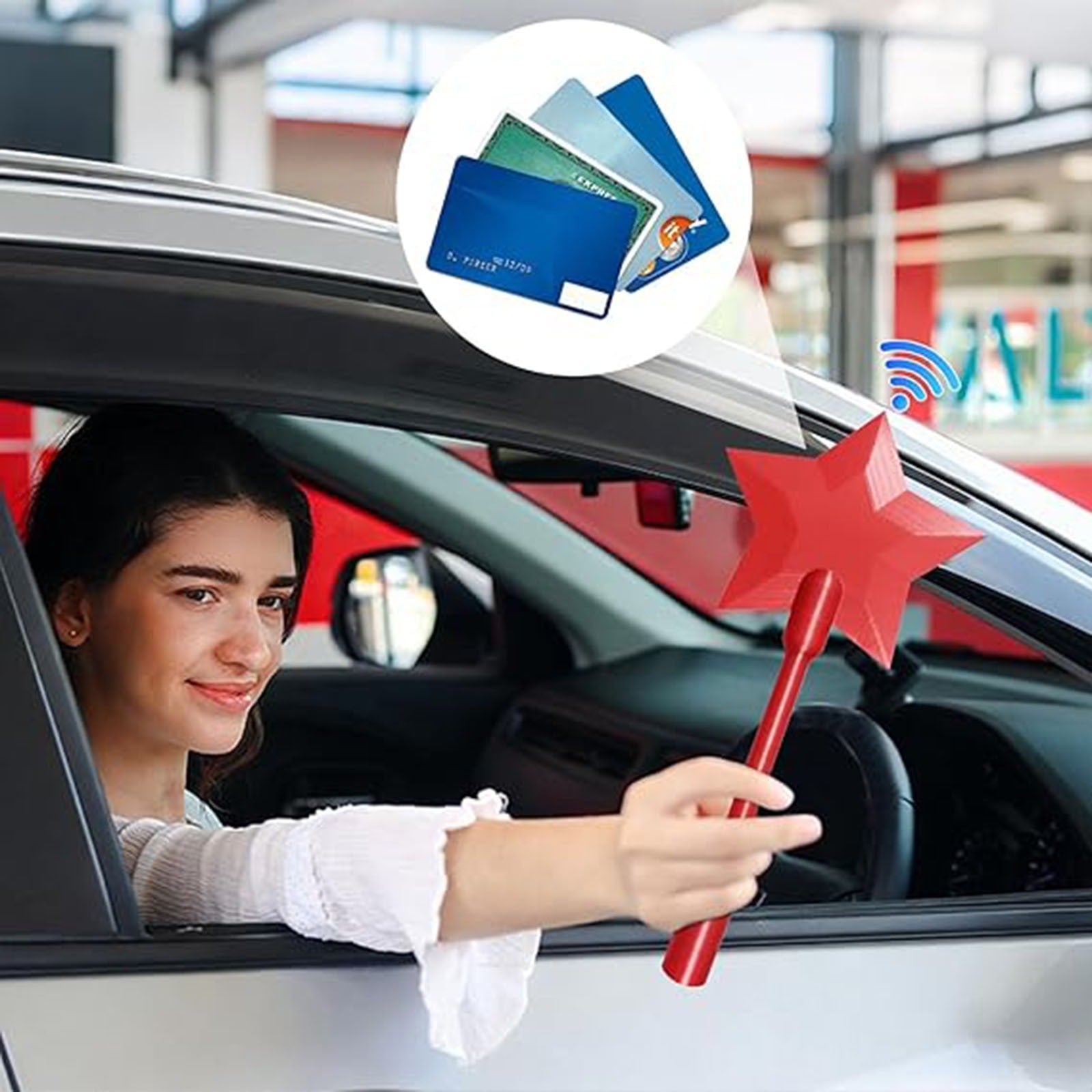 A smiling woman in a car holds the red 3D Printed Tap To Pay Magic Wand by PureAura, showcasing its playful design.