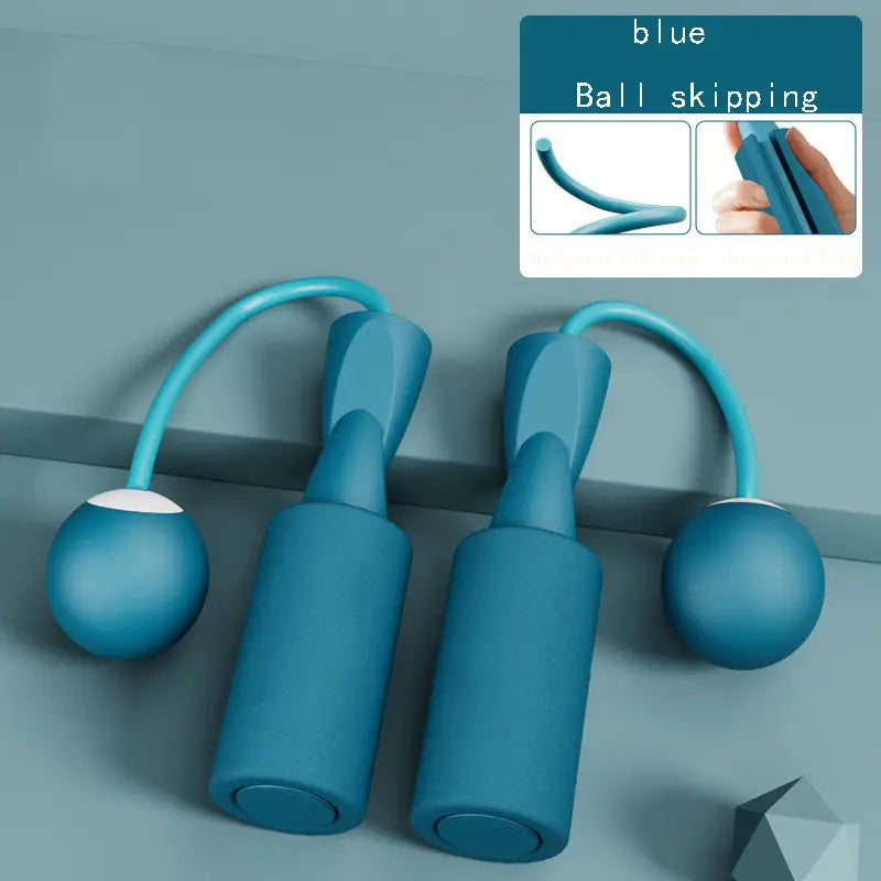 The blue Cordless Dual-use Skipping Rope rests on a textured surface, featuring ergonomic handles by PureAura.