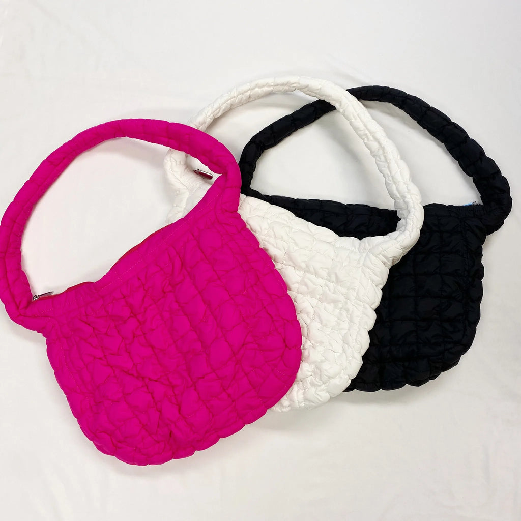 Three Carry All Quilted Cross Body Bags in pink, white, and black, showcasing a soft, textured design by My Store.